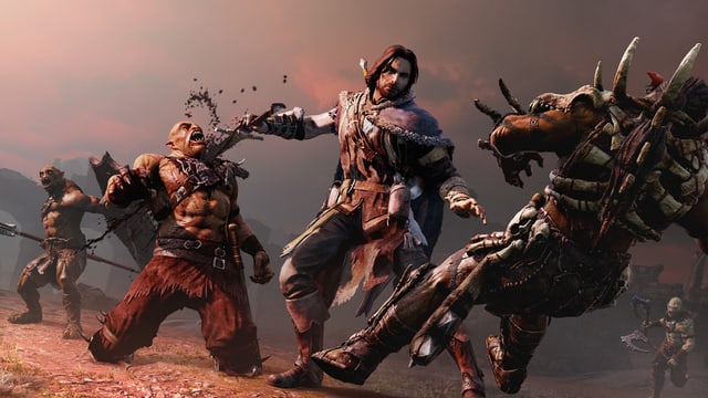 Talion stösst einem Ork den Dolch in die Kehle. Talion stösst einem Ork den Dolch in die Kehle.