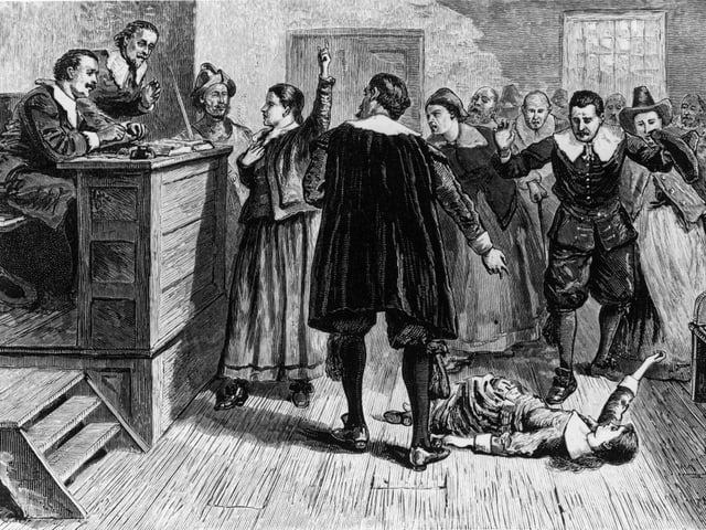 Eine historische Illustration eines Hexenprozesses aus Salem. Eine historische Illustration eines Hexenprozesses aus Salem.