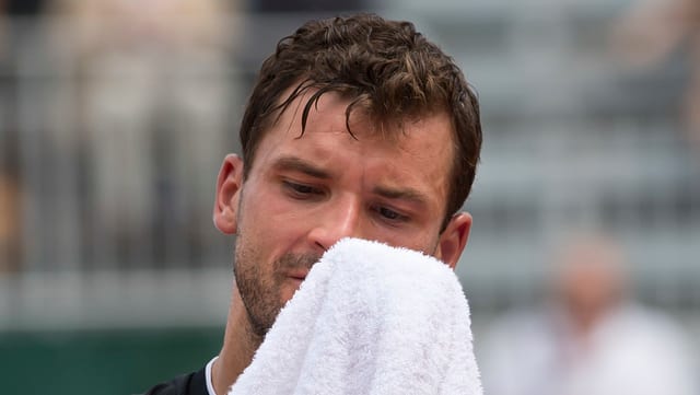 Ein niedergeschlagener Grigor Dimitrov. Ein niedergeschlagener Grigor Dimitrov.
