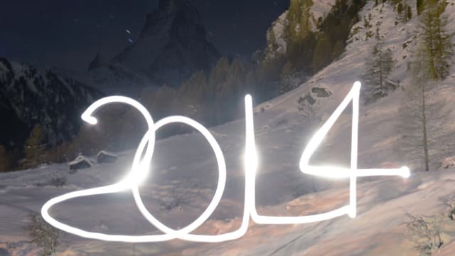 2014 mit Licht gezeichnet - im Hintergrund eine Schneelandschaft. 2014 mit Licht gezeichnet - im Hintergrund eine Schneelandschaft.