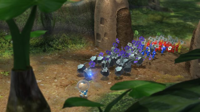 Alph führt seine Pikmin-Armee durch eine Felstür. Alph führt seine Pikmin-Armee durch eine Felstür.