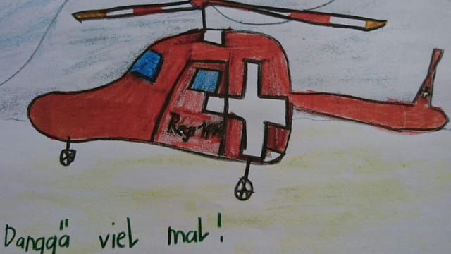 Ein Kind bedankt sich bei der Rega und dem Sozialdienst mit einer Zeichnung. Ein Kind bedankt sich bei der Rega und dem Sozialdienst mit einer Zeichnung.