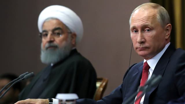 Rohani und Putin an einem Tisch. Rohani und Putin an einem Tisch.