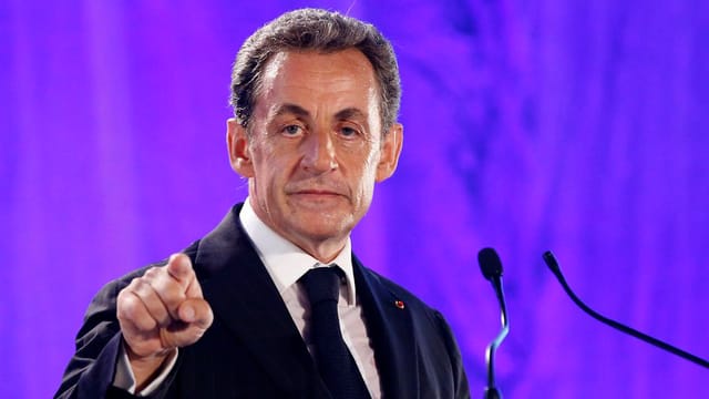 Nicolas Sarkozy an einem Rednerpult. Nicolas Sarkozy an einem Rednerpult.