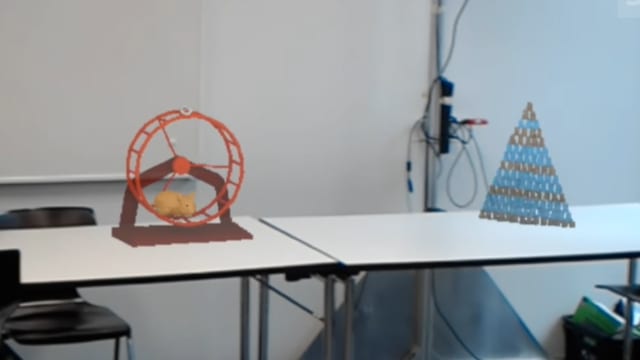 Ein animiertes GIF zeigt, wie Holovect einfache Vektor-Hologramme in die Luft zeichnet. Ein animiertes GIF zeigt, wie Holovect einfache Vektor-Hologramme in die Luft zeichnet.