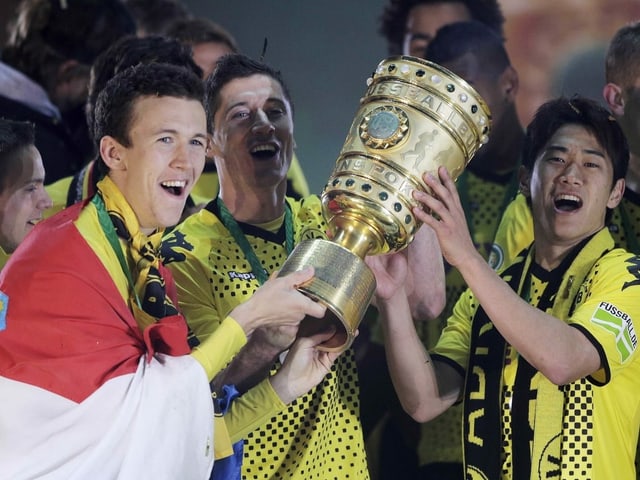 Ivan Perisic, Robert Lewandowski und Shinji Kagawa jubeln. Ivan Perisic, Robert Lewandowski und Shinji Kagawa jubeln.