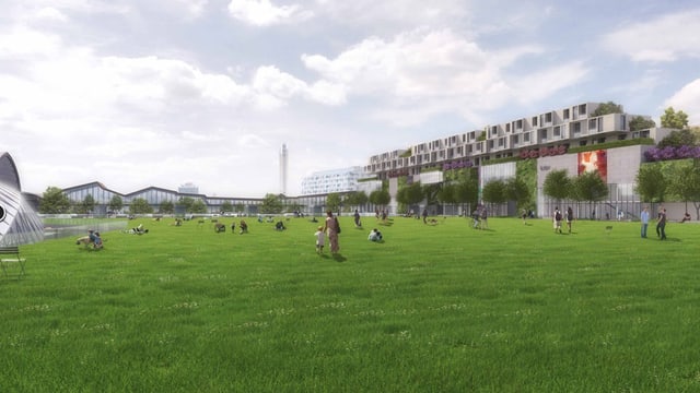 Park mit Menschen im Hintergrund Bahnhofgebäude Park mit Menschen im Hintergrund Bahnhofgebäude