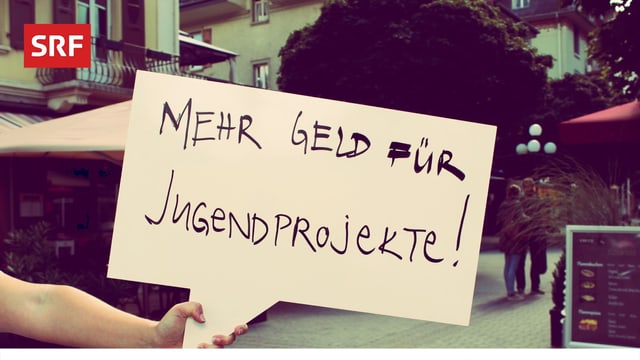 Mehr Geld für Jugendprojekte - schreibt jemand auf die SRF-Fotobox-Tafel.