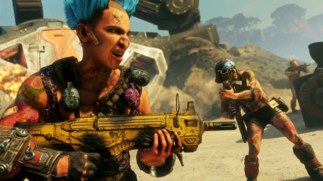 Rage 2 ist voller verrückter Ödländer, wie beispielsweise diesem Herr mit blauer Doppelirokesenfrisur und gelber Waffe. Rage 2 ist voller verrückter Ödländer, wie beispielsweise diesem Herr mit blauer Doppelirokesenfrisur und gelber Waffe.