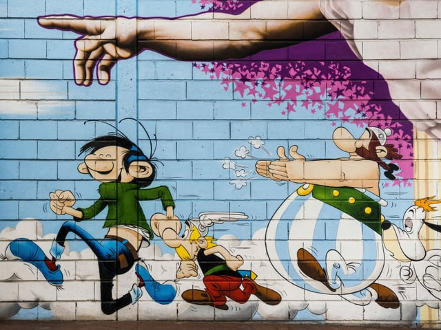 Drei Comicfiguren auf einer Hauswand. Drei Comicfiguren auf einer Hauswand.