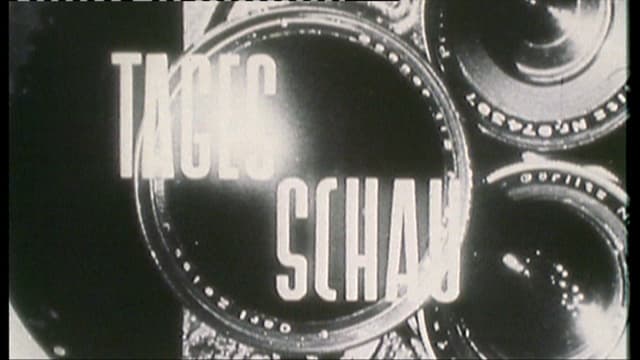 Der Titel der Tagesschau von 1953. Eine Kameralinse im hintergrund und der Schriftzug Tagesschau. Der Titel der Tagesschau von 1953. Eine Kameralinse im hintergrund und der Schriftzug Tagesschau.