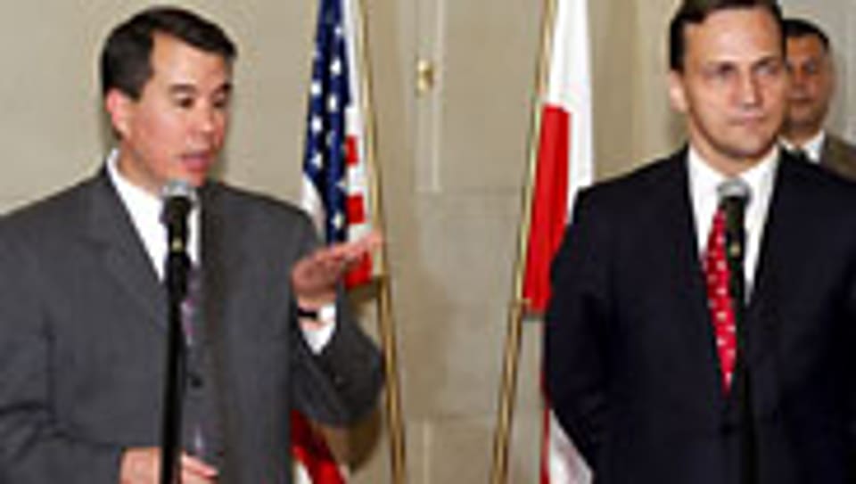 US-Chefunterhändler John Rood u. Polens Aussenminister Radoslaw Sikorski.