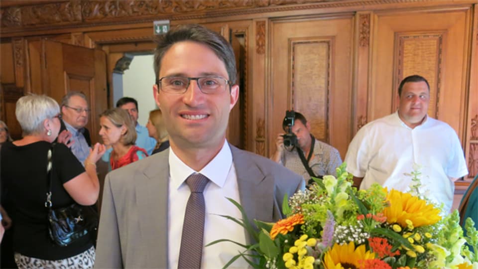 Mann mit Blumenstrauss: Lukas Engelberger (CVP)