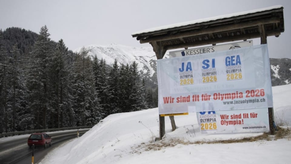 Am 12. Februar entscheiden die Stimmberechtigten im Kanton Graubünden über die Kandidatur. Plakat in Davos.