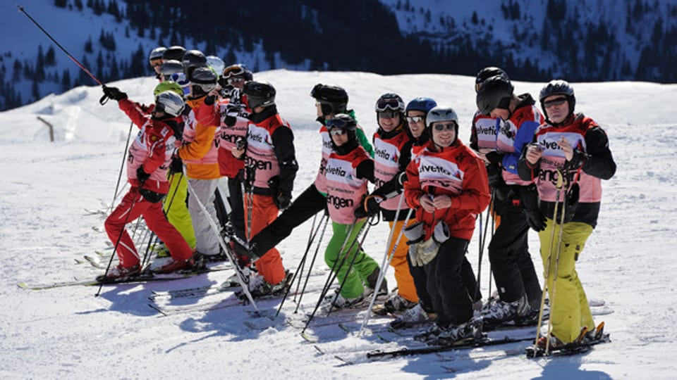 Über 700'000 Freiwillige setzen sich allein im Schweizer Sport ein, zum Beispiel an den Internationalen Lauberhornrennen.