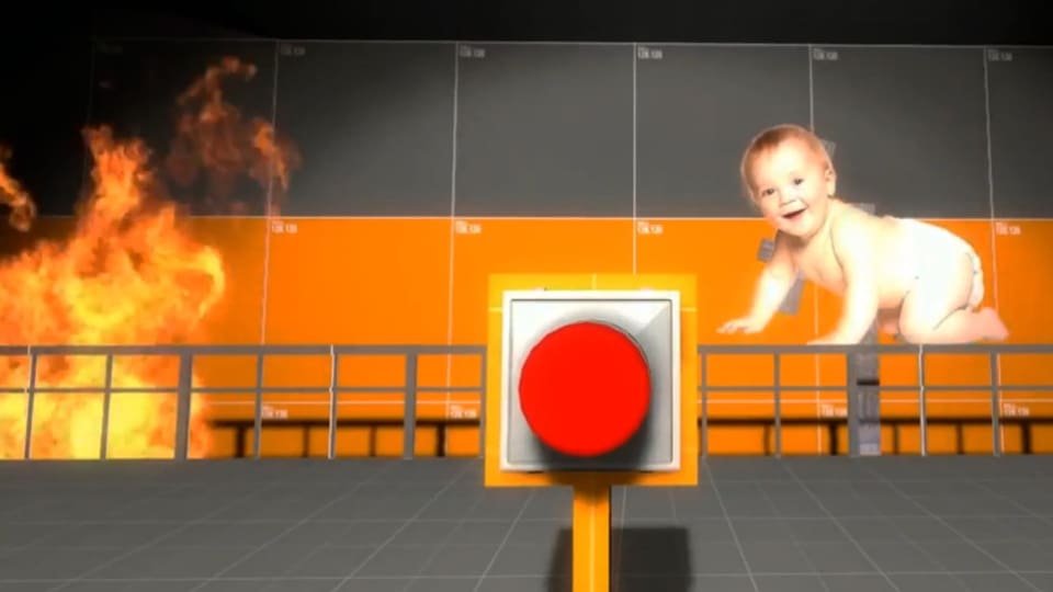 Nur wer vier Stunden lang den roten Knopf drückt, schützt das herzige Baby vor dem Flammentod.