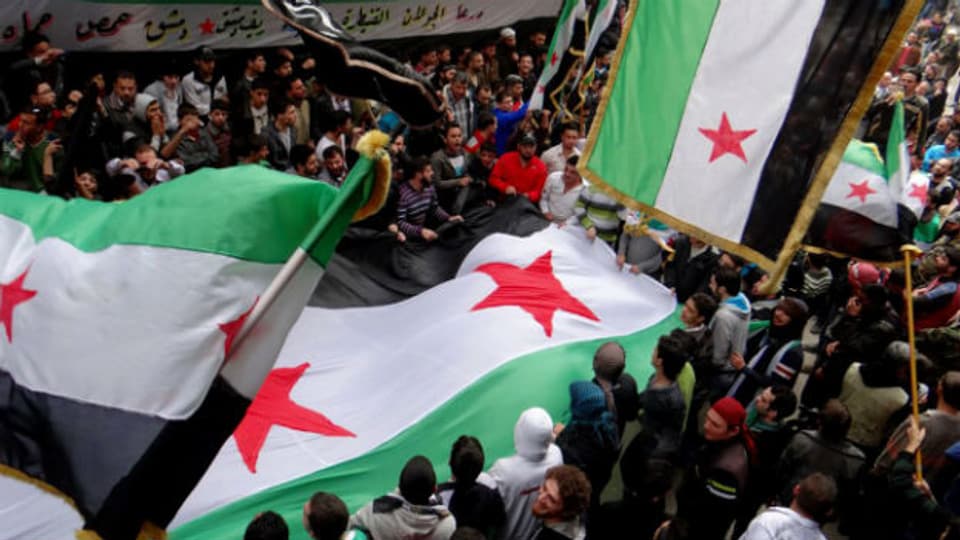 Menschen in Aleppo feiern den zweiten Jahrestag der syrischen Revolution.