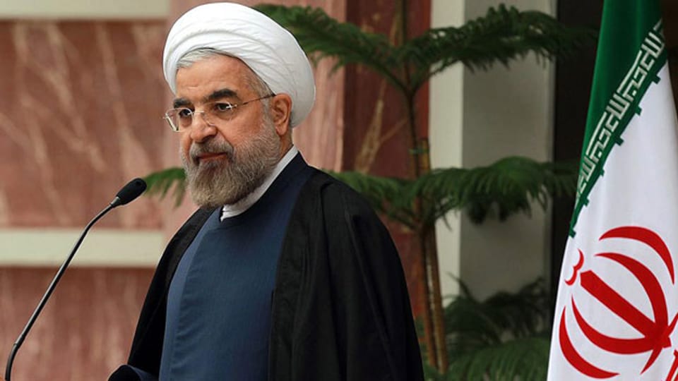 Iran und sechs Weltmächte vereinbarten, dass Iran sein Atomprogramm begrenzt. Der iranische Hassan Rowhani während eines Mediengespräch in Teheran am 24. November 2013.