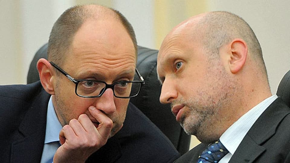 Der ukrainische Übergangs-Premier Arseni Jazenjuk und Präsident Alexander Turtschinow scheinen ratlos.