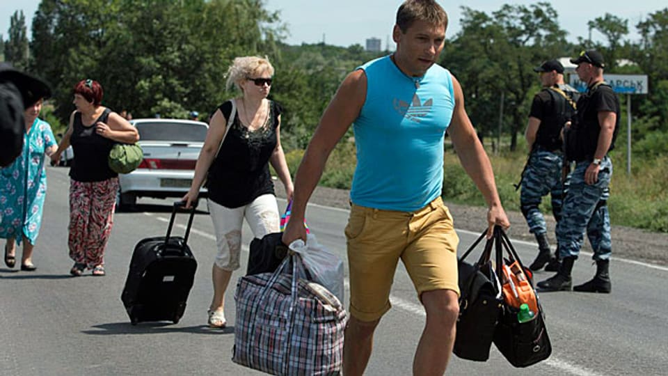 Immer mehr Menschen versuchen aus der Region um Donezk zu flüchten.