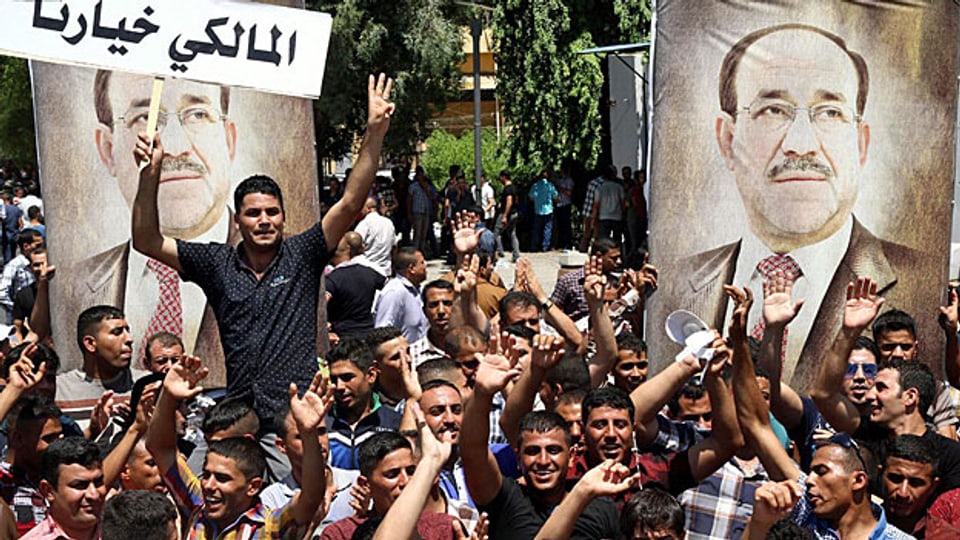 «Maliki ist unsere Wahl» steht auf dem Plakat von Pro-Maliki-Demonstranten in der irakischen Hauptstadt Bagdad. Nun wurde aber ein anderer Kandidat mit der Regierungsbildung beauftragt.