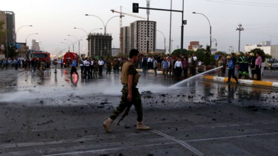 Kurdische Sicherheitskräfte nach einem Bombenattentat in Erbil im Norden Iraks am 23. August 2014.