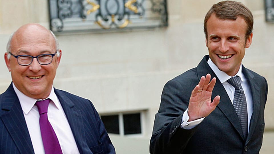 Frankreichs Finanzminister Michel Sapin und der neue französische Wirtschaftsminister Emmanuel Macron.