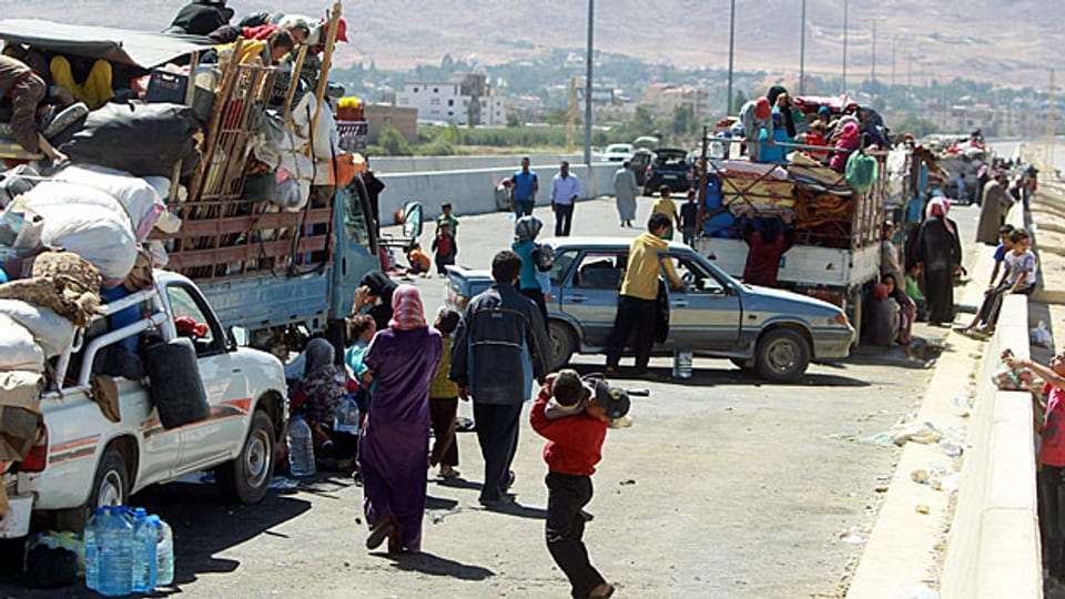 Syrische Flüchtlinge an der Grenze zu Libanon: Künftig benötigen sie für die Einreise ein Visum.
