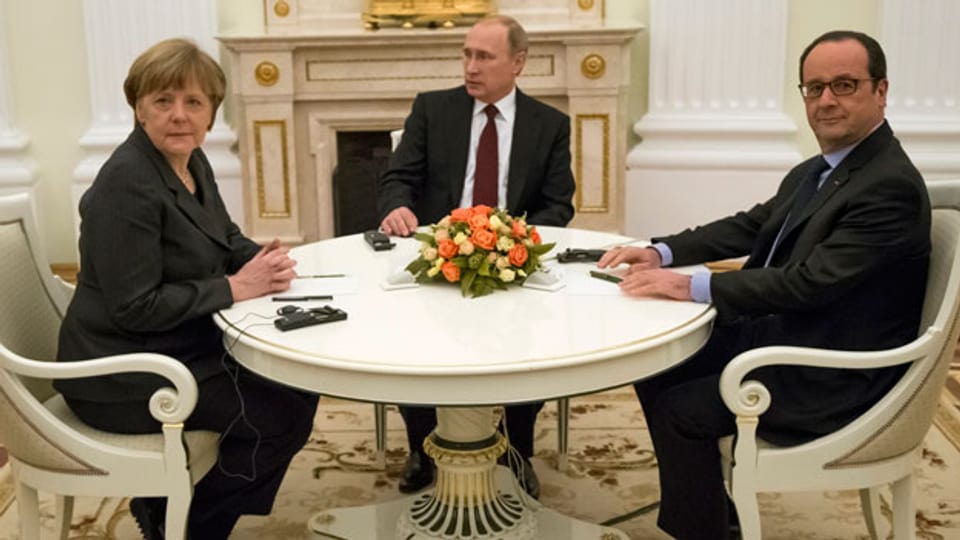 Merkel, Putin und Hollande haben sich am Freitag zu Gesprächen in Moskau getroffen. Archiv.