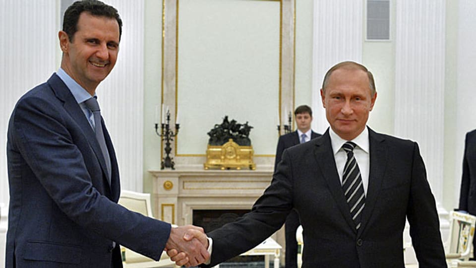 Der Teilrückzug russicher Truppen aus Syrien – ein geschickter Schachzug? Bild: Der syrische Präsident Assad und der russische Präsident Putin.