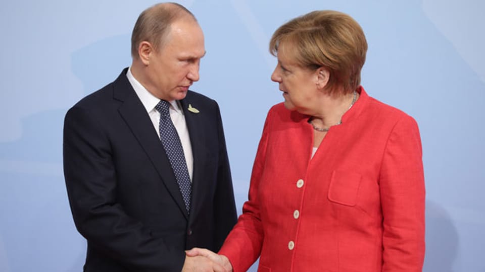 Wladimir Putin und Angela Merkel.