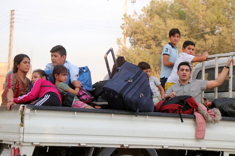 Kurdische Familie auf der Flucht.