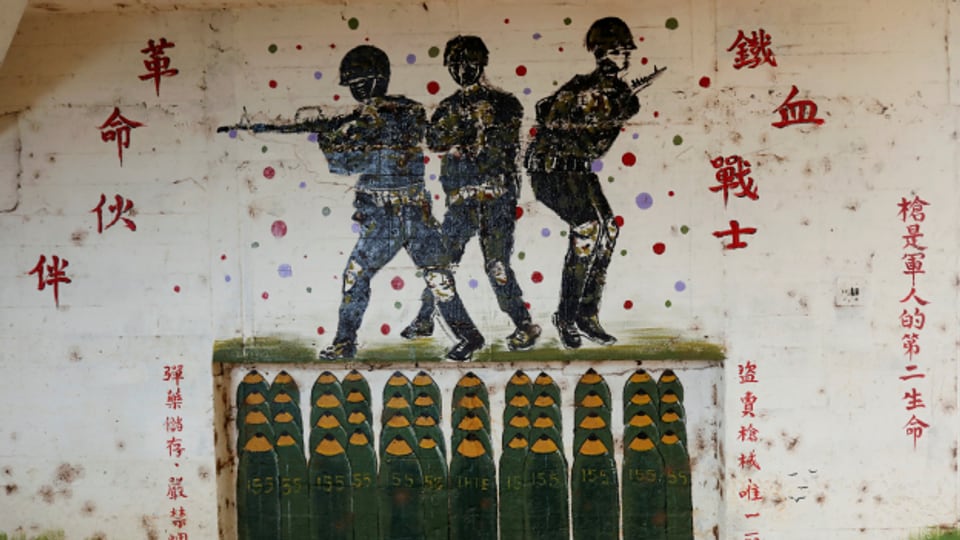 Ein Graffiti in einer ehemaligen Waffenfabrik macht auf chinesische Waffen aufmerksam.