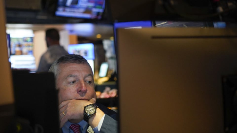 Lange Gesichter an der Wall Street in New York. Die Aktienkurse befinden sich weltweit auf Talfahrt.