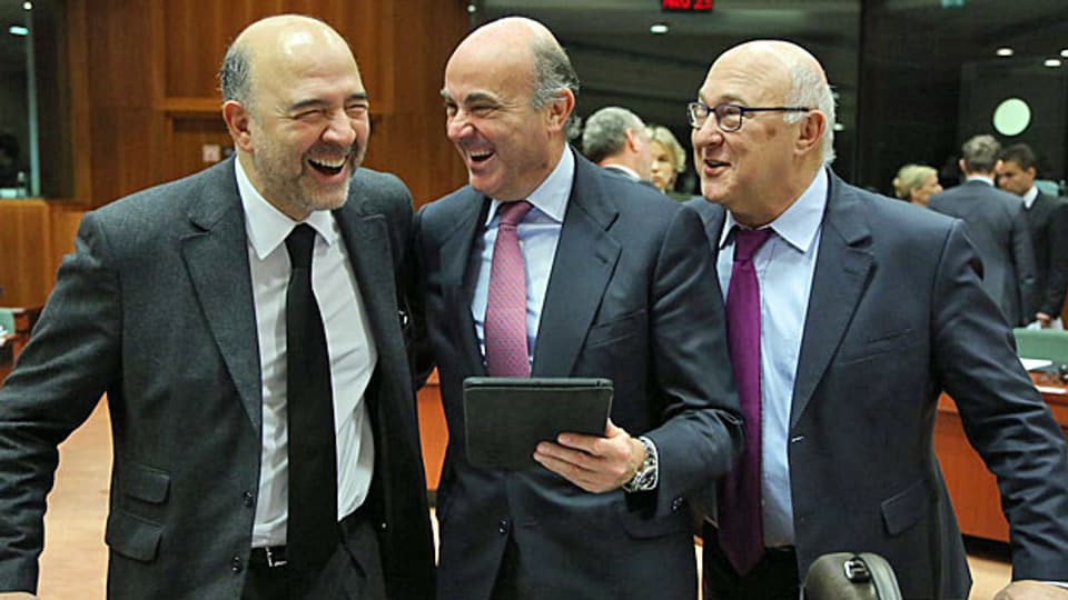 Ecofin-Treffen in Brüssel, EU-Wirtschafts- und Währungskommissart Pierre Moscovici, der spanische Wirtschaftsminister Luis de Guindos und der französische Finanzminister Michel Sapin scheinen sich über die Lizenzboxen zu freuen.