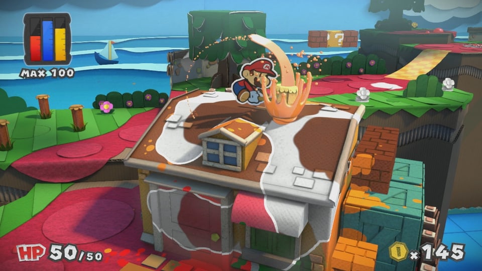 Mario haut auf die weissen Flecken eines Hauses.