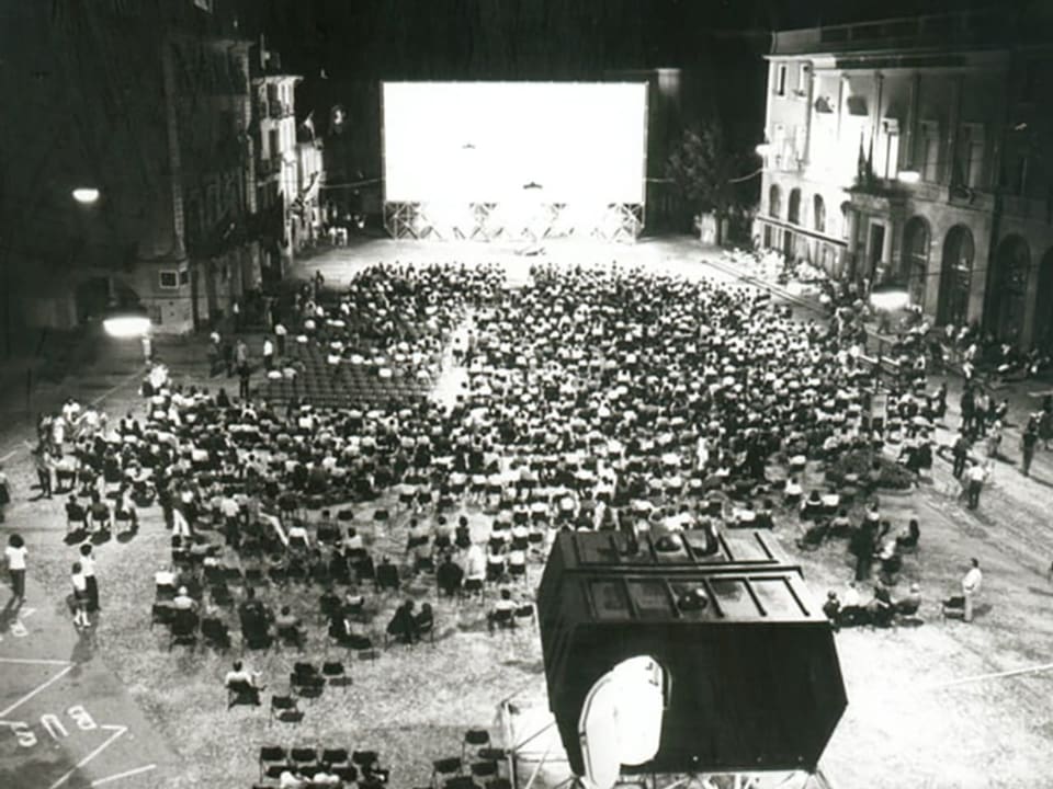 Black and white photo: Piazza Grande with the audience