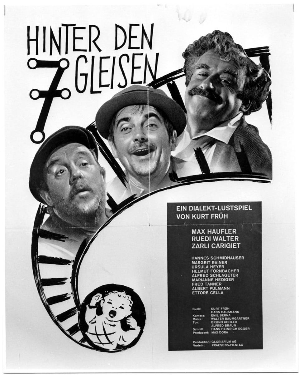 Das Filmplakat von «Hinter den sieben Gleisen» mit drei fröhlichen Männern darauf.