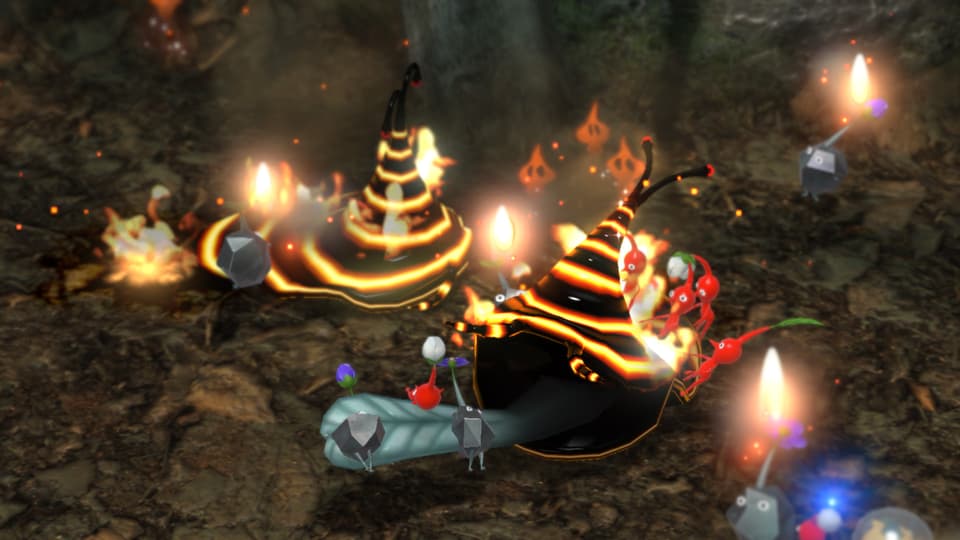 Rote Pikmin bekämpfen ein Feuerviech, Fels-Pikmin verbrennen sich dran.