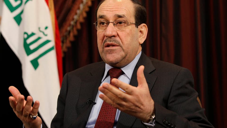 Nuri al-Maliki hält beide Hände offen vor sich