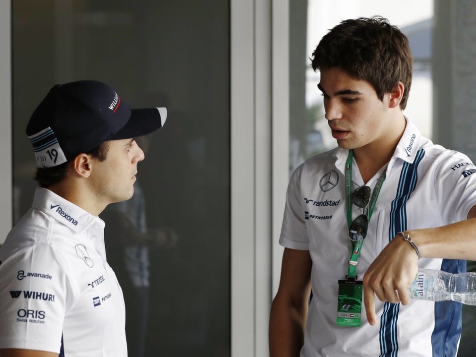 Der kanadische Teenager Lance Stroll (18) spricht mit Felipe Massa (36).