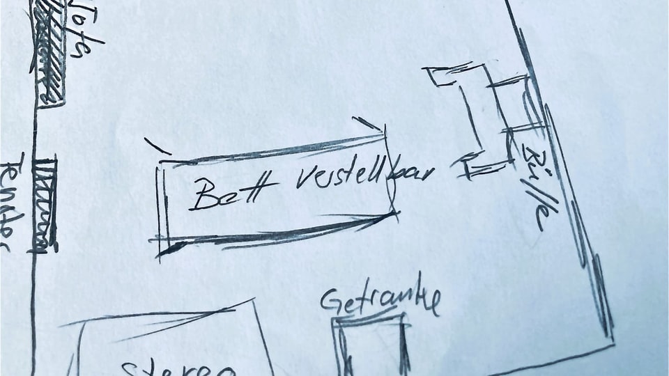 Skizze eines Raumplans mit Bett in der Mitte