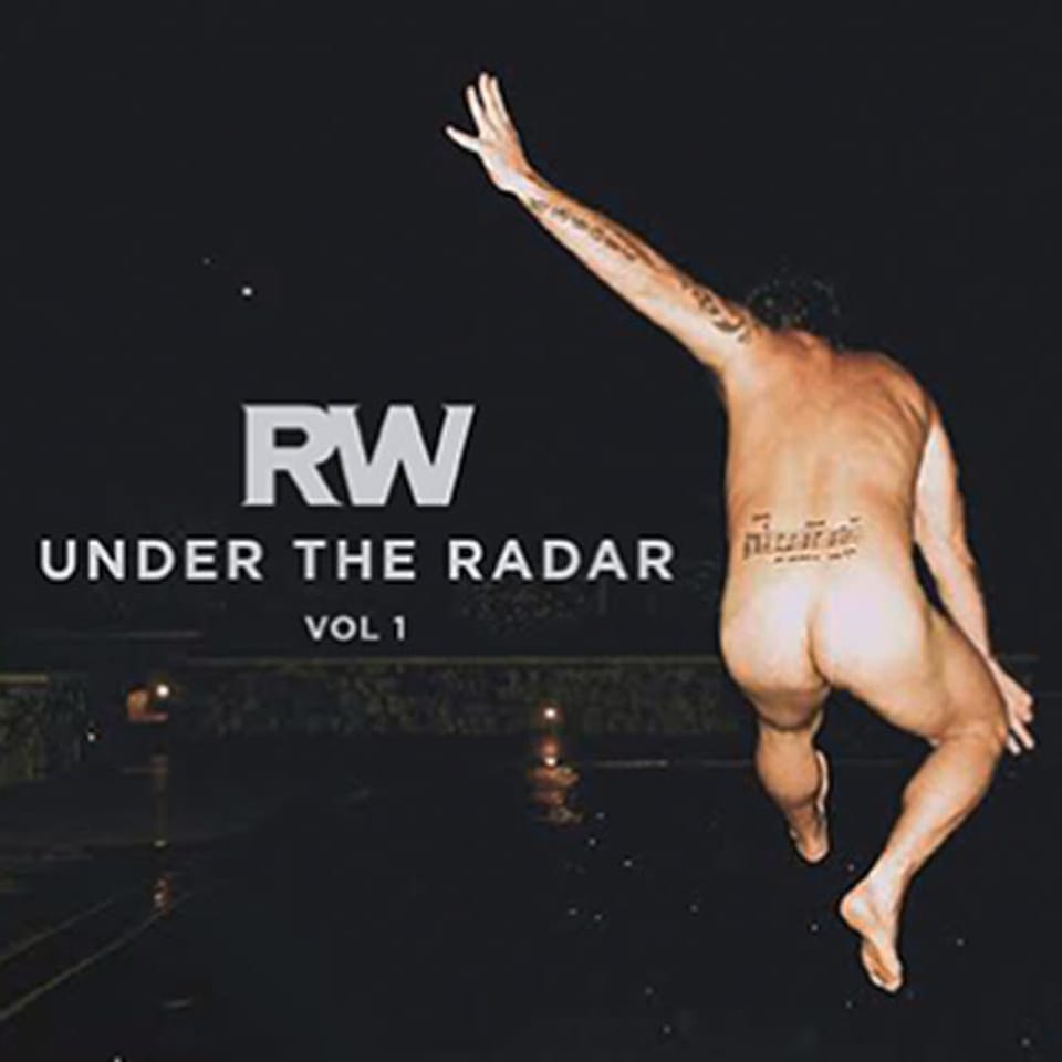 Nackter Robbie Williams von hinten auf seinem neuen Album-Cover
