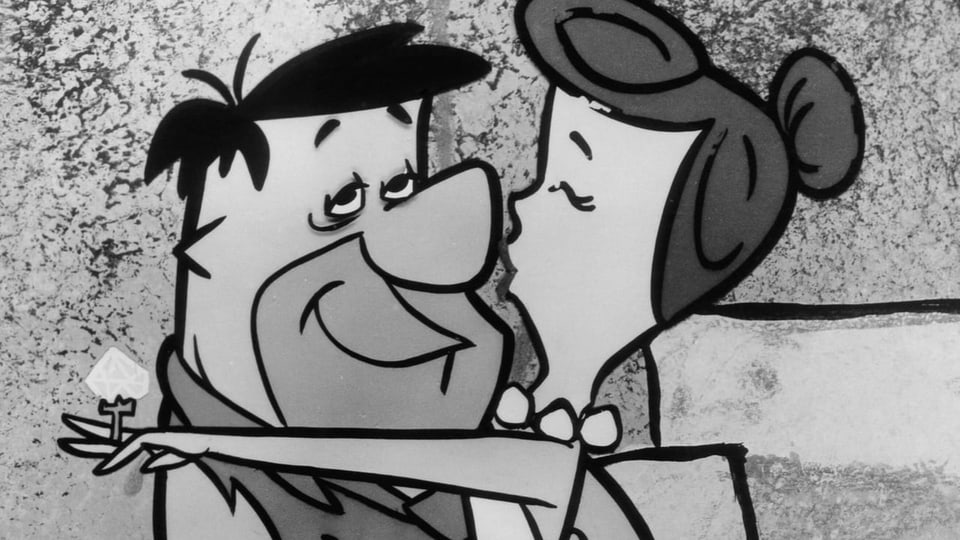 eine schwar-weiss Zeichnung, wie Wilma ihren Mann Fred küsst