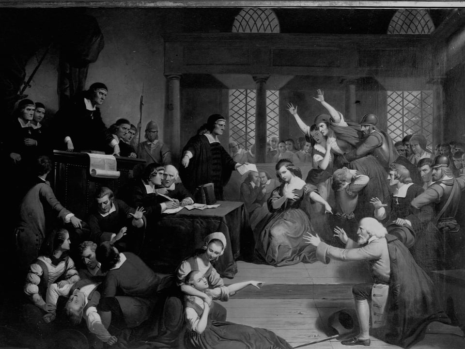 Gemälde einer Prozesses im 17. Jahrhundert: Richter in Roben stehen Menschen gegenüber, die auf ihre Knie fallen.