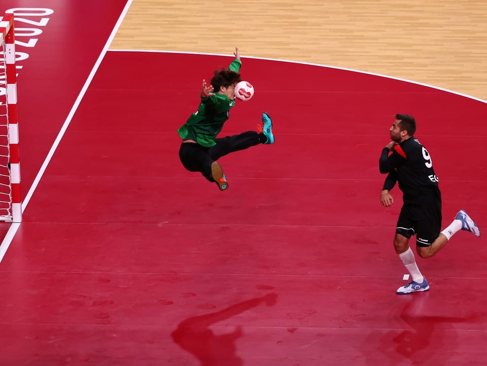 Tokyo 2020 Olympics - Handball - Men - Group B - Japan v Egypt - Yoyogi National Stadium - Tokyo, Japan - July 28, 2021. Yuta Iwashita of Japan saves a shot taken by Mohammad Sanad of Egypt REUTERS/Susana Vera/File photo SEARCH "BEST OF THE TOKYO OLYMPICS" FOR ALL PICTURES. TPX IMAGES OF THE DAY.