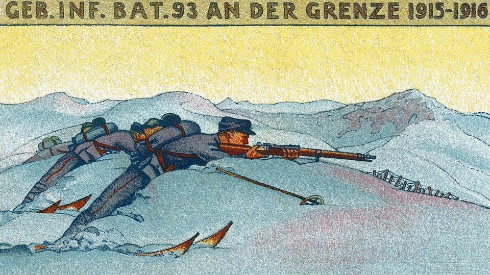 Soldaten mit Gewehr im Anschlag liegen im Schnee.