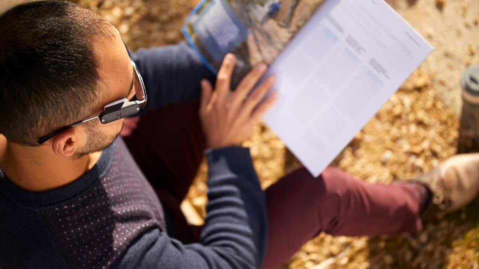 The picture shows a man with glasses.