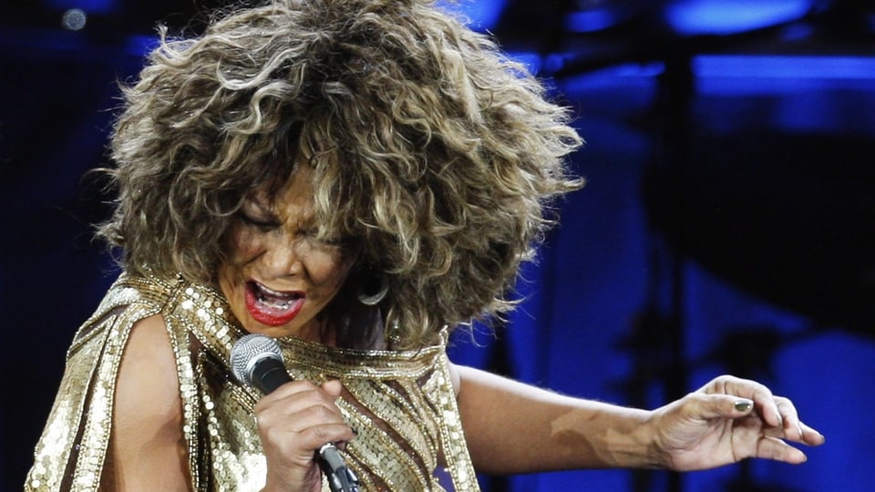 Tina Turner sings during the performance.