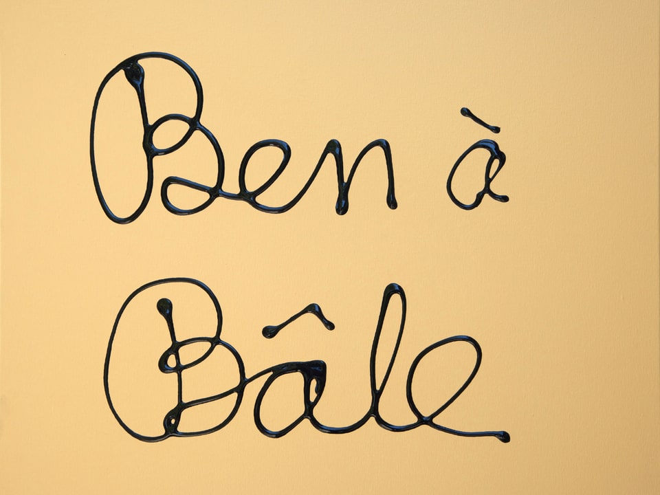 Auf gelblichem Hintergrund steht in schwarzer Schrift «Ben à Bâle».
